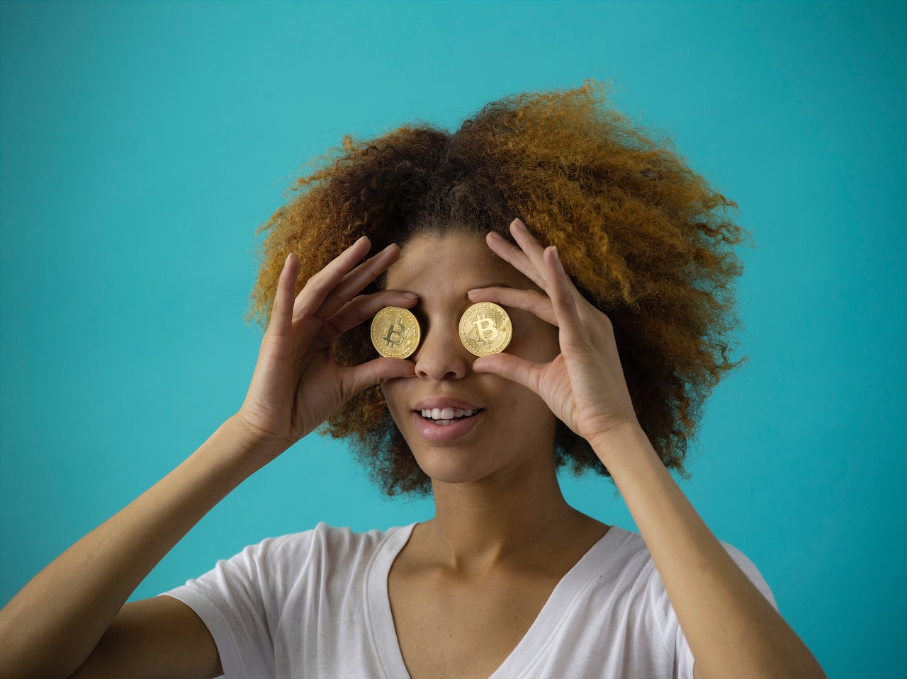 woman holding cryptocurrencies