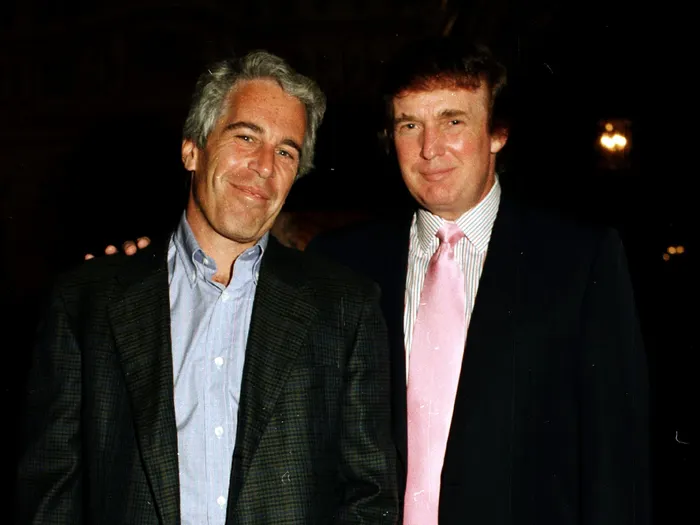 American financier Jeffrey Epstein (L) and then-real-estate developer Donald Trump (R) pose together at the Mar-a-Lago estate, Palm Beach, Florida, 1997. Davidoff Studios/Getty Images
