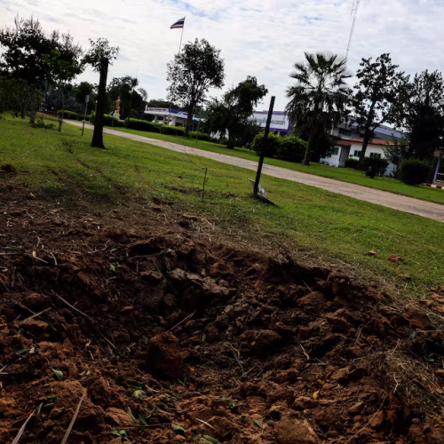 A view of a crater in the ground following an attack by Cambodia's artillery, after Thailand scrambled an F-16 fighter jet to bomb targets in Cambodia on Thursday after artillery volleys from both sides killed civilians, at the Phanom Dong Rak Hospital, in Surin, Thailand, July 25, 2025. REUTERS/Athit Perawongmetha